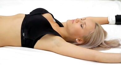 Blonde Russian captive submits to controlled touch in a bondage session