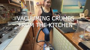 VACUUMING CRUMBS FROM THE KITCHEN