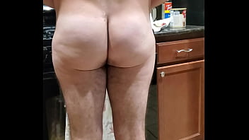 naked man showing ass while cooking