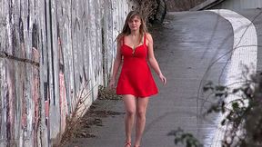 Sexy babe in red hot dress finds a place to urinate