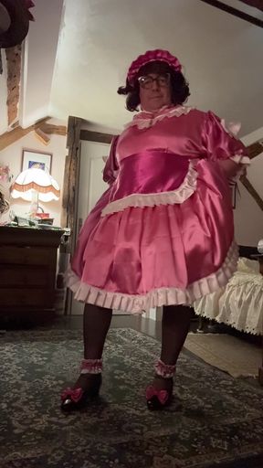 Dressed in a pink maid outfit for the day
