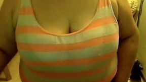 This chubby charmer enjoys showing off her huge saggy breasts