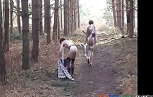 Sara and Jade strip in the woods