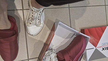 Dirty sneakers dirty feet in a public store 4K