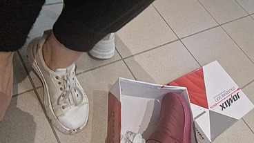 Dirty sneakers dirty feet in a public store 4K