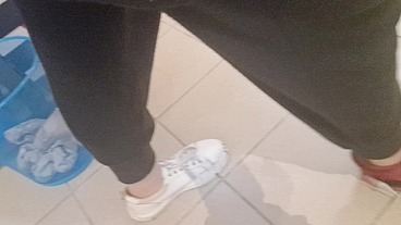 Dirty sneakers dirty feet in a public store 4K