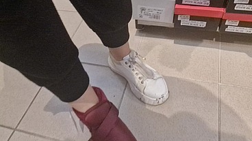 Dirty sneakers dirty feet in a public store 4K