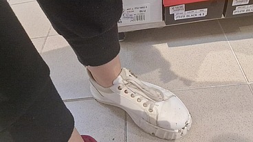 Dirty sneakers dirty feet in a public store 4K