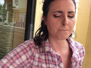 Making her cum her publicly with remote dildo below the table