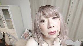 Japanese crossdresser experiences pleasure while wearing a summer dress