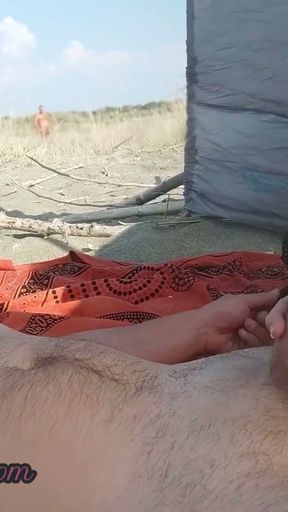 My wife jerks my dick in front of a stranger in nudist beach   Clip 1