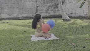 Sit to burst rubber balloons in the garden