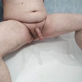 Pissing With Spraying Cock action in the bathroom.