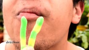 eating worm gummies in my garden