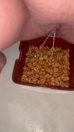 Girl pees in a bowl of cereal