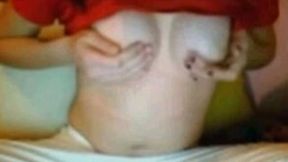 This raven haired nympho shows off her nicely shaped breasts