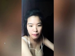 Vietnam brunette bares her big boobs to play with them