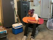 Putting riser pads on my roommates skateboard in my garage