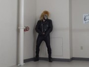 masked leather man quickly shoots his load in hotel stairway