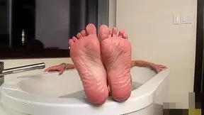 Jenna Tales Teases with her Shemale Feet in Tub