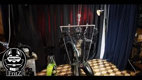 latex slave bound and suspended and master humiliated his cock