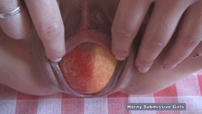 After a short walk in park, I feed my pussy with the fruit and she finds it delicious