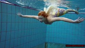 Blonde in a dress in a pool