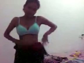 Naughty and hot busty amateur Indian teen shows off her breasts in the bedroom