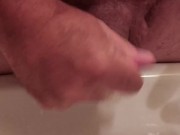 Folding foreskin in underneath itself, simulating circumcision