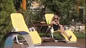 Aroused babes lick and suck huge rod in a garden threesome