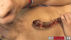 Twink jerks off while penetrating his ass with dildo