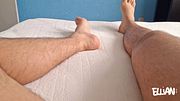 College boy massages his feet, taking off his long, sweaty socks