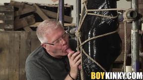 ”Helpless twink has his prick stroked by older gay master”