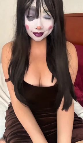 Curvy clown girl sits alone and exposes her body