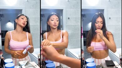 Asian girlfriend dances while cooking breakfast
