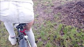 Naughty teen rides dildo in her miniskirt on public bike