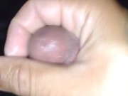 Sexy guy jacking off in front of a bunch of men in open adult theater while watching tranny porn