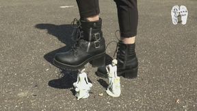 Two porcelain figures crushed under Boots