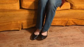 Fifi dangling black ballet flats in blue jeans