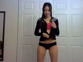 Fabulous Asian brunette on webcam stripteasing completely