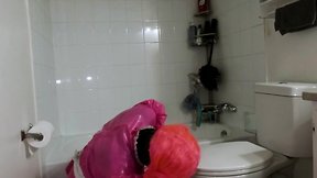 Steel chastity belt and dildo cleaning bathroom by a sissy maid