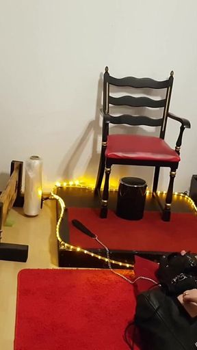 Curvy Brunette Dominatrix Commands Bound Slave in Fetish Dungeon
