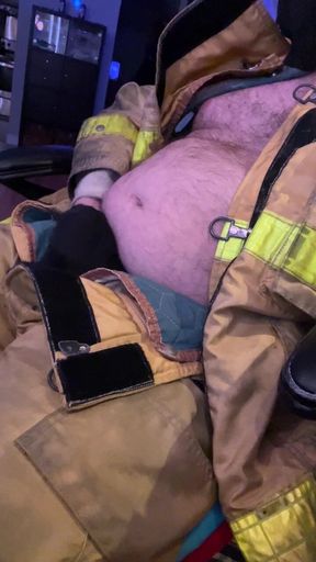 Show cock wearing firefighter gear
