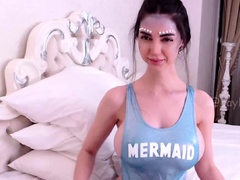 Busty babe playing with her big boobs