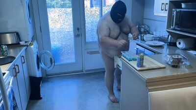 Pluged SuperChub cleans his kitchen