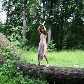 Nude dance on felled tree