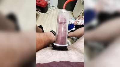 Amateur gay bloke is pumping his prick with his toy