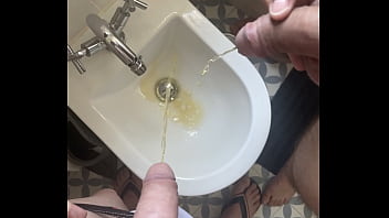 2 amateur boys flatmates (1 ginger, circumcised, with undies and flip flops, 1 naked uncut) pissing together in a bidet