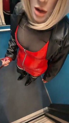 Public Walk in Parking House, Blonde in Overknee Boots, Red Pvc Dress and Long Leather Coat.