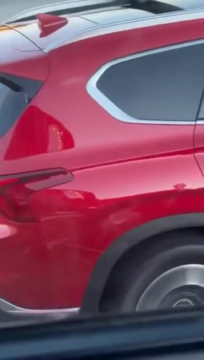 Red Car in Motion